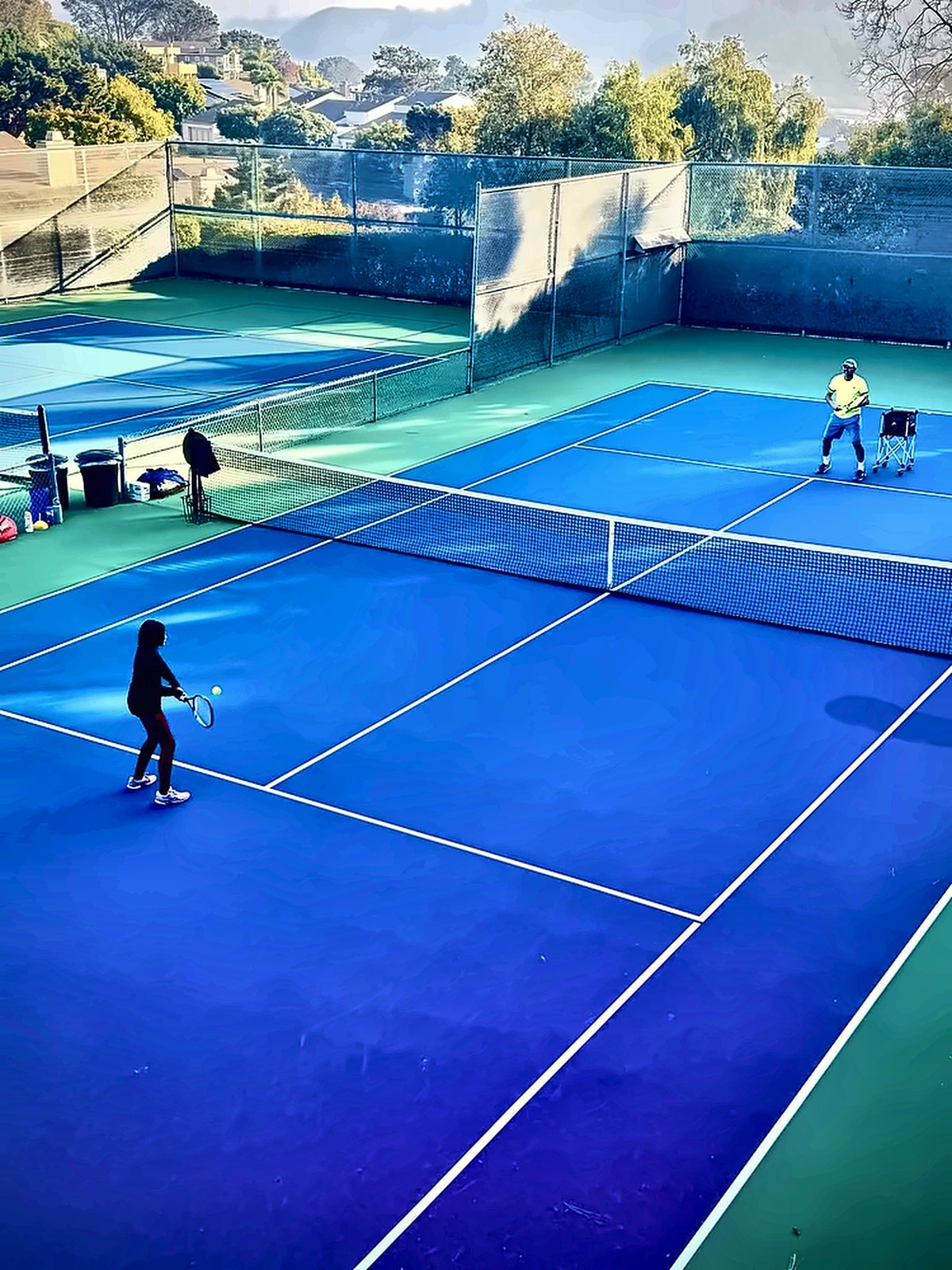 Lesson on hillside hard courts